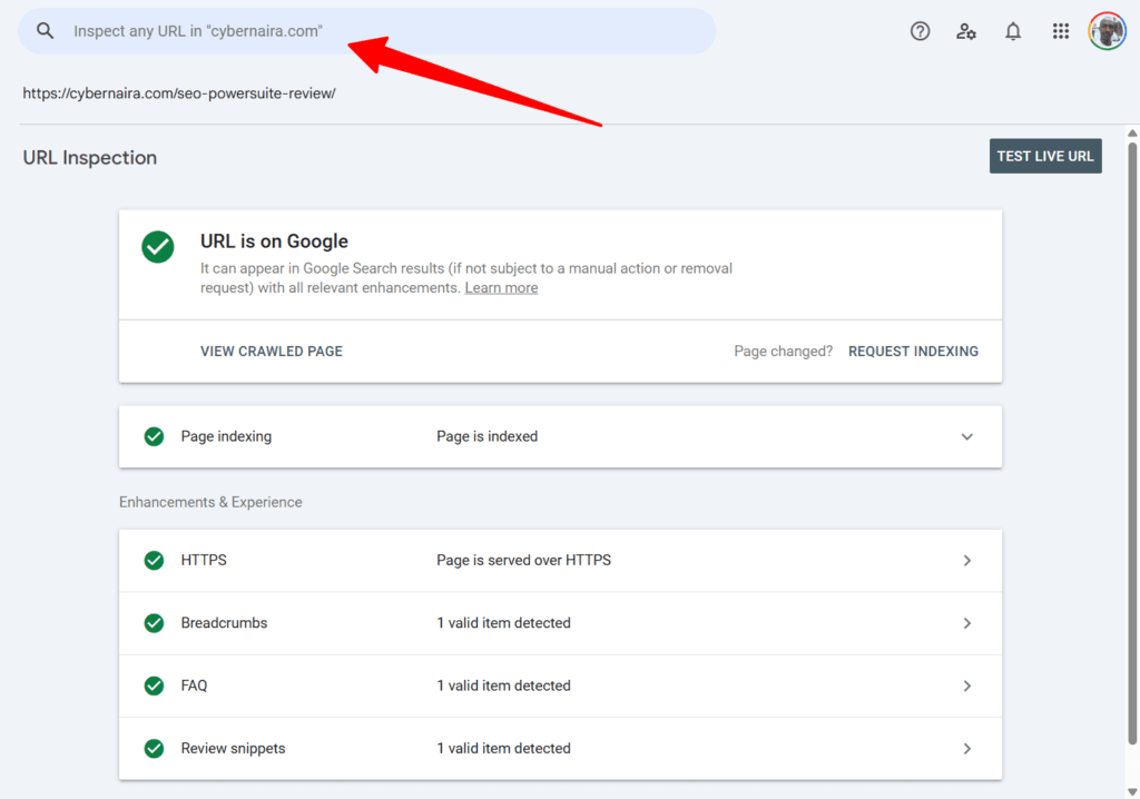 Google Search Console URL inspection tool dashboard showing green checkmarks for indexed status and valid enhancements with a red arrow pointing to the search box.