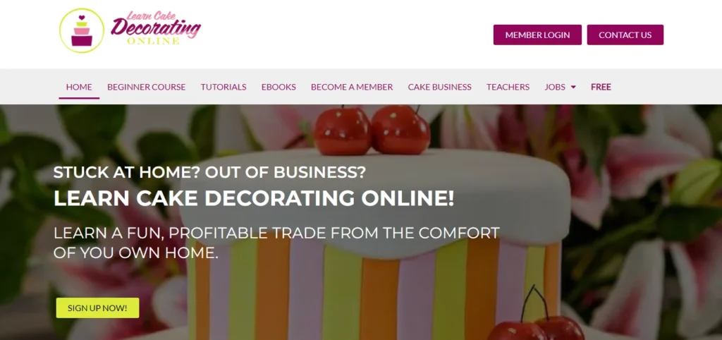 Learn Cake Decorating Online homepage featuring a banner with text about learning a profitable trade from home and a yellow Sign Up Now button.