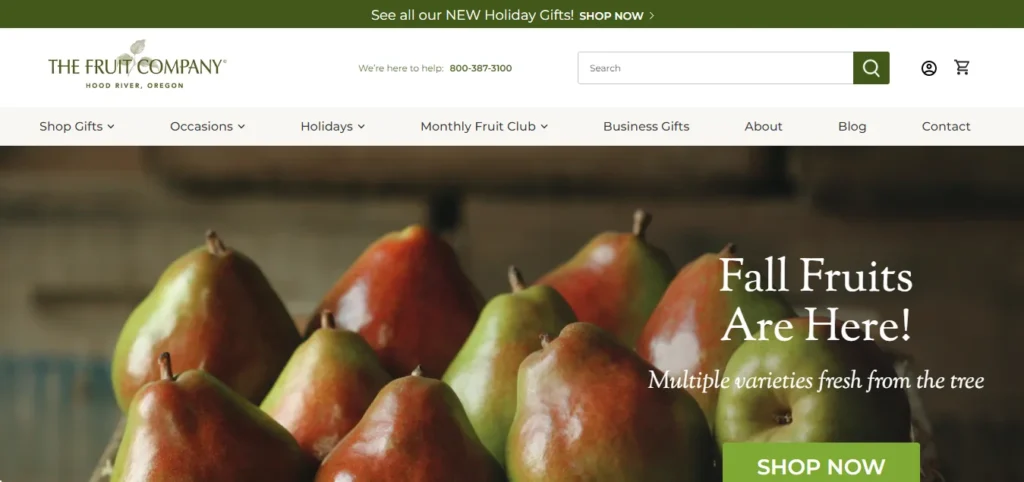 The Fruit Company website banner featuring pears with text announcing fall fruit availability and a shop now button.
