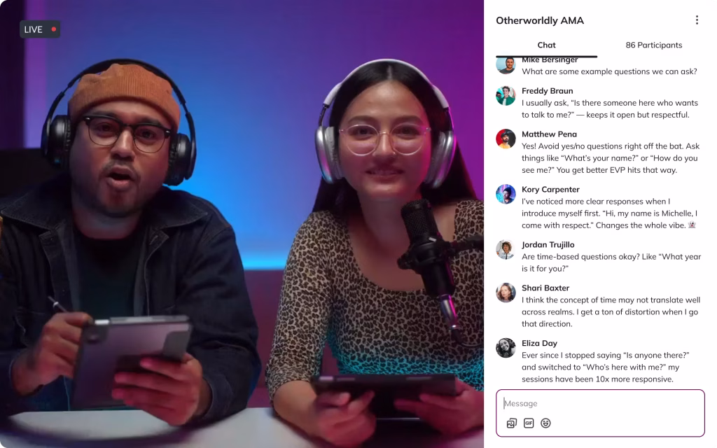 Two professional hosts conducting a live 'Otherworldly AMA' video session within a Mighty Networks community platform. The man wears an orange beanie and glasses while holding a digital tablet, and the woman wears studio headphones and a leopard print top. A sidebar displays an active chat with 86 participants discussing Electronic Voice Phenomena (EVP) and spirit communication tips against a blue and purple neon background.