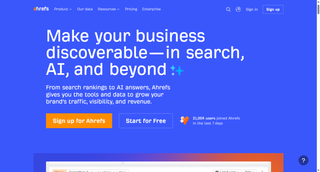 Ahrefs homepage featuring headline "Make your business discoverable—in search, AI, and beyond" with sign-up and free start buttons.