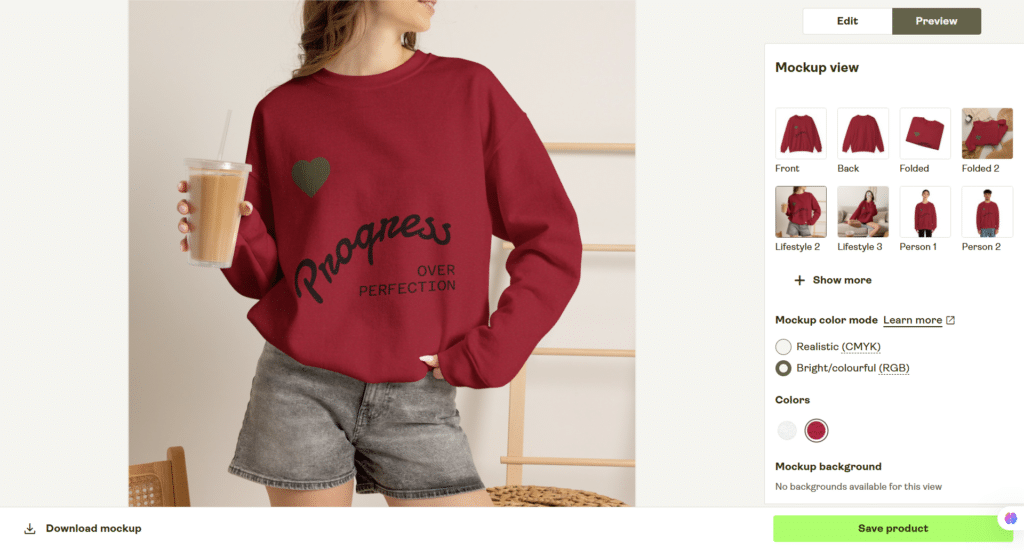 printify lifestyle mockup of a custom crewneck sweat shirt Lifestyle mockup of a woman wearing a custom burgundy Gildan 18000 crewneck sweatshirt featuring the "Progress Over Perfection" design created in Printify.
